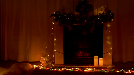 New-year-and-Christmas-celebration-near-fireplace-in-room