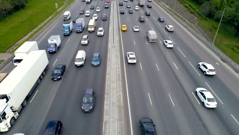 A-yellow-taxi-car-moves-on-a-highway-under-a-road-bridge.-4K.