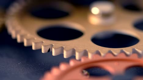 clock-wheels-turning,touching-each-other---close-up