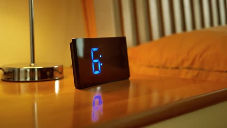 dolly-shot-of-alarm-clock-turns-7-AM