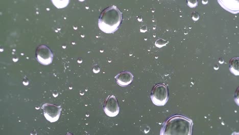 Heavy-rain-on-the-window-in-4k-slow-motion-60fps