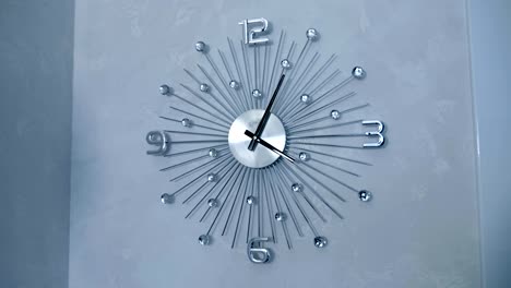 Beautiful-chrome-wall-clocks-with-decorative-glass-inserts-on-the-wall