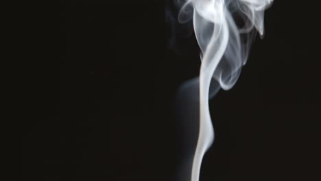 Curly-smoke-stream-on-black-background