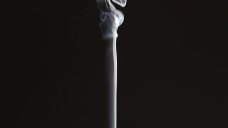 Thin-smoke-stream-on-black-background