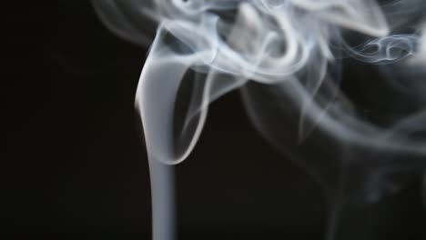 SLOW-MOTION:-Smoke-lifts-and-dispels-on-a-black-background