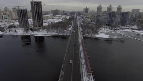 traffic-on-the-bridge,-near-the-metro-rides,-shooting-from-the-air