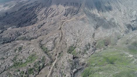 Aerial-view-flight-over-Cemoro-Lawang,-small-village-in-morning-mist