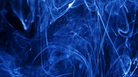 Shot-of-Ink-Moves.-Cosmic-abstraction-of-a-light-blue-particle-ink.-macro