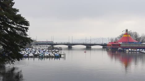 switzerland-zurich-limmat-river-quaibrÃ¼cke-bridge--yacht-dock-circus-day-panorama-4k