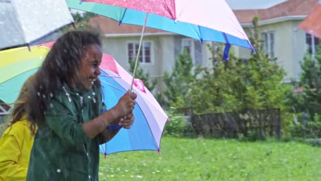 Happy-Children-Running-with-Umbrellas-in-Rain