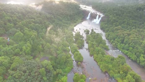 Waterfall-Surrounded-By-Lush-Green-Forest-Aerial-View