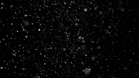 Slow-Motion-Schnee-auf-schwarzem-Hintergrund