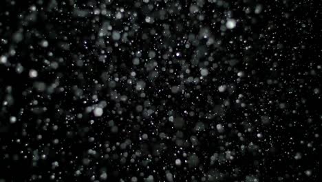 Slow-Motion-Snow-on-Black-Background