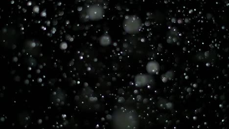 Slow-Motion-Schnee-auf-schwarzem-Hintergrund