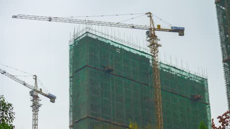 wuhan-city-day-time-apartment-buildings-construction-panorama-4k-time-lapse-china