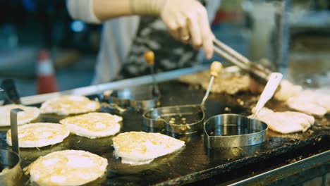 chicken-dice-cooking-and-flamed-on-bbq-grill-oven.-Night-market-street-food-vendor-in-Taiwan