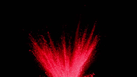 Red-powder-exploding-on-black-background-in-super-slow-motion