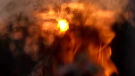 Slow-motion-flame-fire.-Burning-flame-of-fire-close-up-on-sun-background