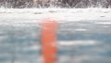 Slow-motion-raining-droplets-on-ground-heavy