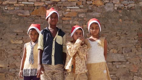 MS-Kids-with-Santa-hats-looking-at-the-camera-rather-reserved