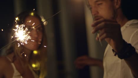 Couple-Dancing-with-Sparklers-in-Hands