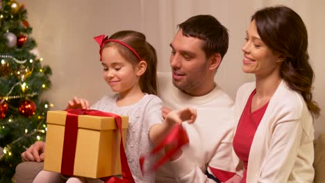 happy-family-with-christmas-present-at-home