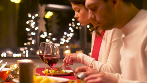 happy-couple-eating-at-christmas-dinner