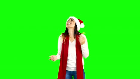 Woman-in-santa-hat-and-warm-clothing-looking-upwards