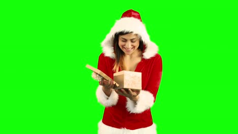 Sexy-girl-in-santa-costume-opening-a-gift