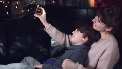 4k-Authentic-Shot-of-a-Child-with-his-Mum-Making-Selfie