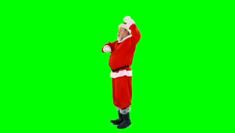 Santa-claus-dancing-against-green-background