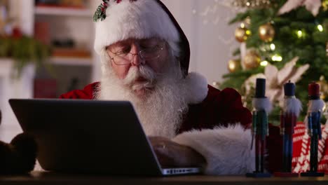 Santa-Claus-in-workshop-using-computer