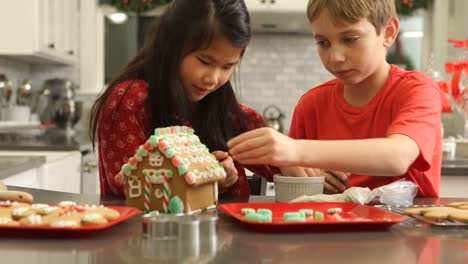 Decorating-gingerbread-house-for-Christmas