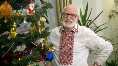 Pleasant-old-man-laughs-near-the-christmas-tree