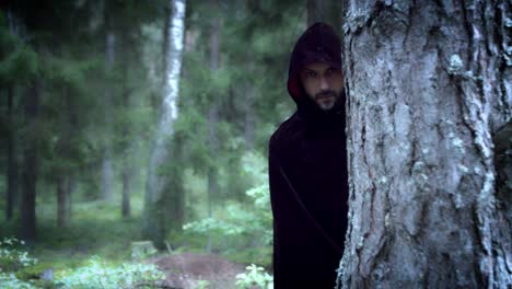 4K-Halloween-Horror-Man-Hiding-in-Woods-with-Black-Cape