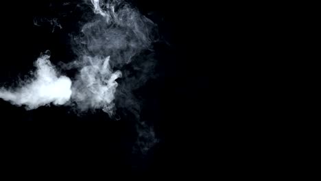 Smoke-billowing-over-a-black-background.