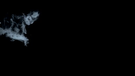 Smoke-billowing-over-a-black-background.