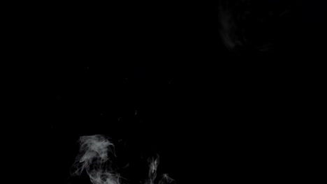 Smoke-billowing-over-a-black-background.