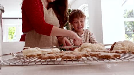 Mother-and-daughter-preparing-Christmas-cookies