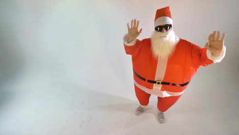 Santa-in-an-inflatable-suit-waves-in-fast-speed.