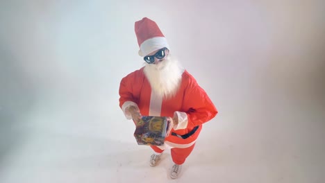 Santa-shows-a-gift-hidden-behind-his-back.