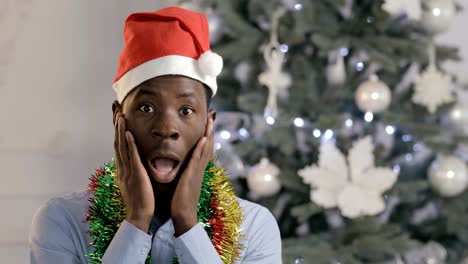 Oh-my-god,-Christmas-holiday-is-now,-african-man-in-Santa-hat