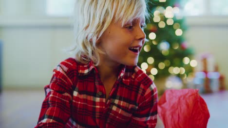 Young-Boy-Opening-Christmas-Presents