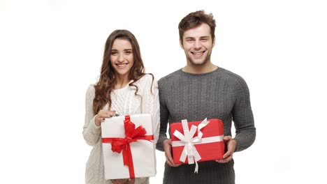 4k-Young-couple-showing-presents-in-Chrismas-day-on-white-background.