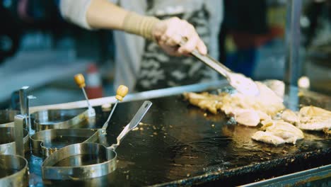 chicken-dice-cooking-and-flamed-on-bbq-grill-oven.-Night-market-street-food-vendor-in-Taiwan