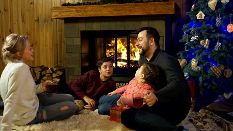 Content-family-at-fireplace-before-Christmas