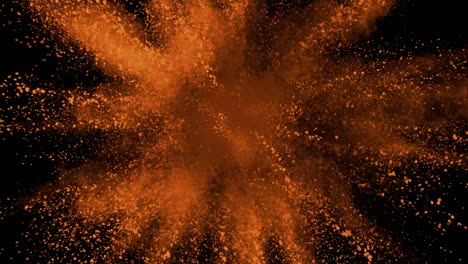 Orange-powder-exploding-on-black-background-in-super-slow-motion