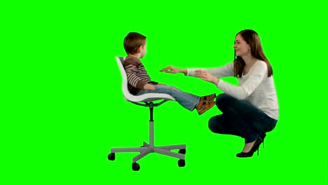 Mother-and-boy-play-game-on-a-Green-Screen