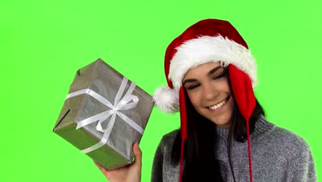Gorgeous-Santa-Claus-woman-smiling-holding-Christmas-gift