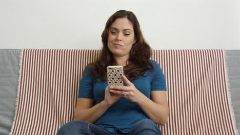 Slow-motion-of-woman-shopping-online-using-her-cell-phone,-ends-happy